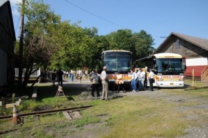 tour-buses-parked-rustic-location-e1366139506980